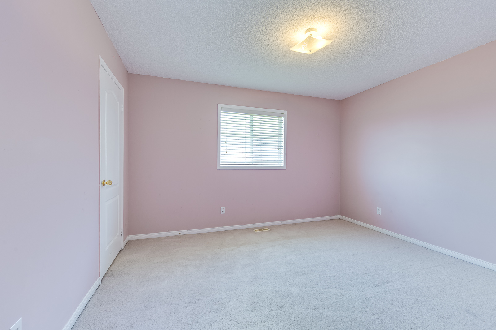Empty room with pink walls
