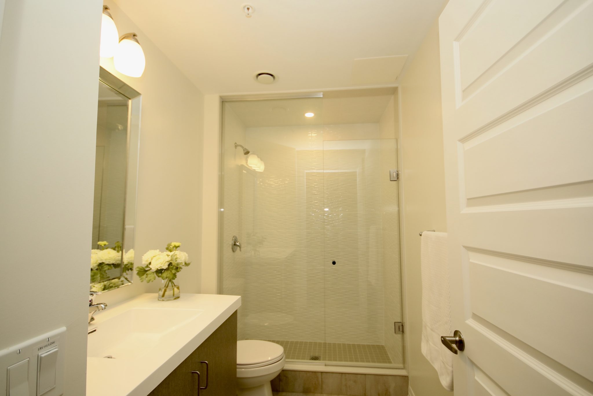 Large bathroom with standup shower.