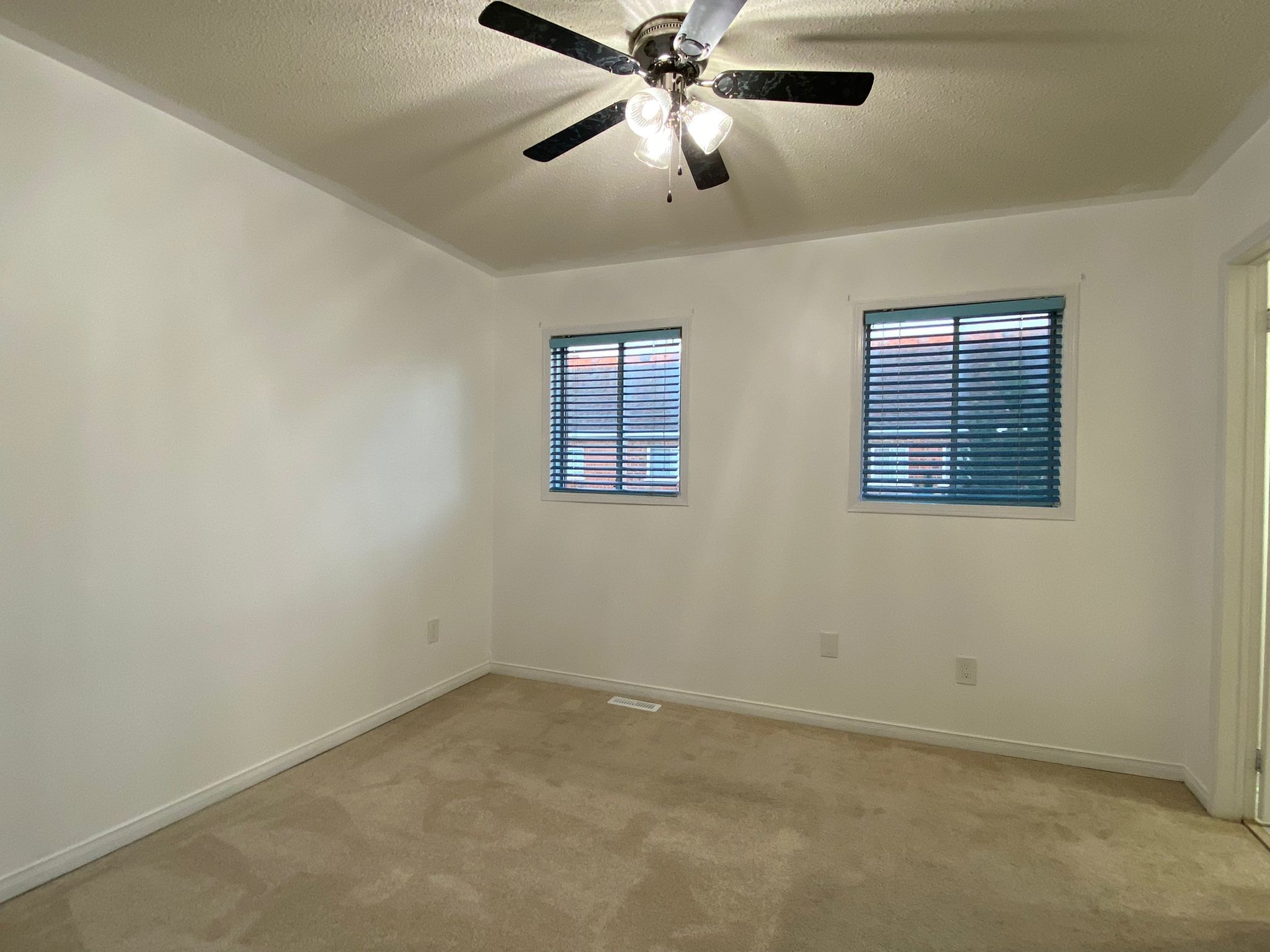 Empty room with fan hanging