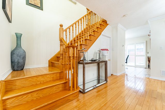 Wooden stairs leading to the second floor at 14 White Rd., Brampton