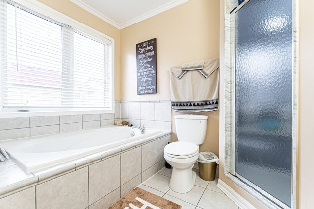 Master Ensuite with standup shower and bathtub at 14 White Rd, Brampton