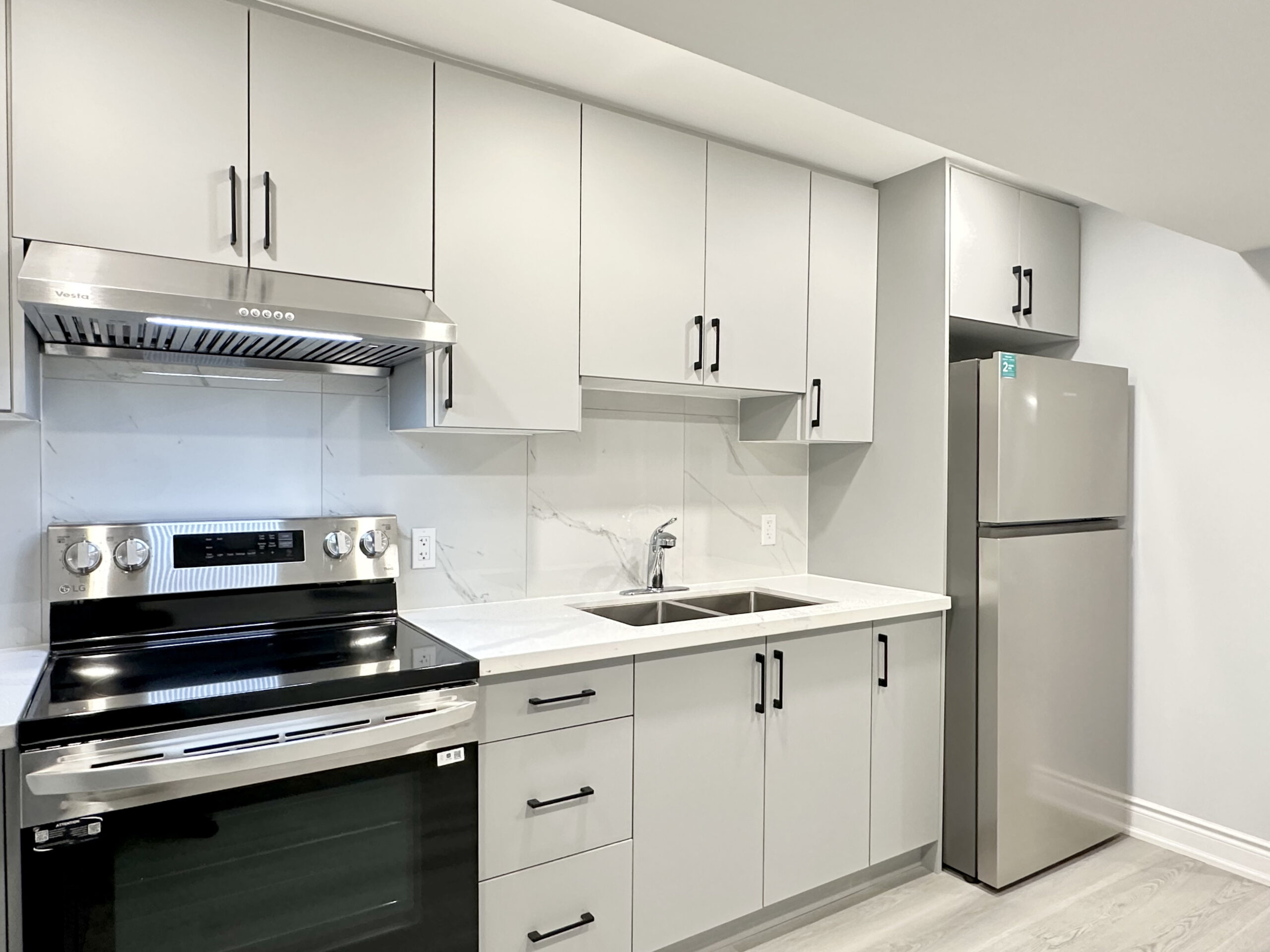 Modern kitchen with stainless steel appliance with Quartz counter top