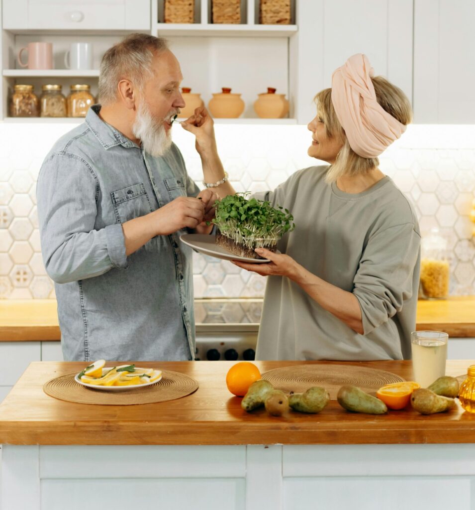 Happy mature couple in a kitchen discussing bridge financing options for their new home.