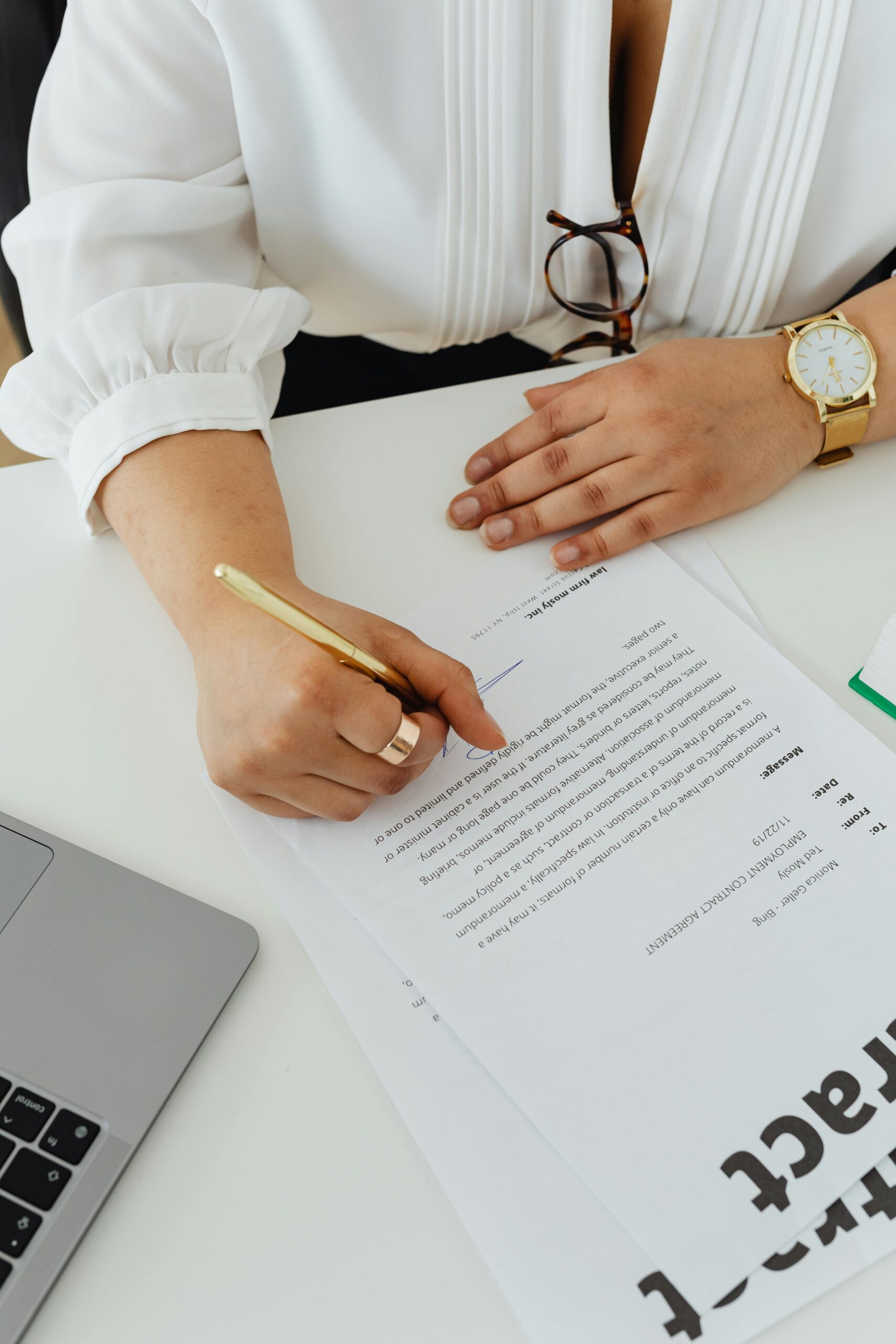 Real estate lawyer reviewing legal documents for a client, highlighting the importance of a title search in Ontario.