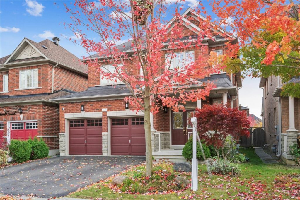 Exterior of 4-bedroom home for sale in Markham with brick facade and double garage.