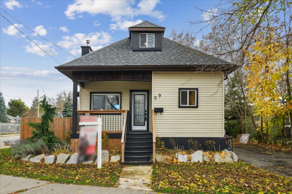 Front view of 59 Stanley St., a beautifully updated property representing modern homes in Brantford, with a private lot and great curb appeal.