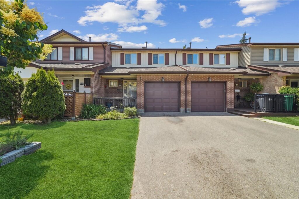 Two-storey brick townhouse with single garage and landscaped front yard at 226 Baronwood Court, Brampton