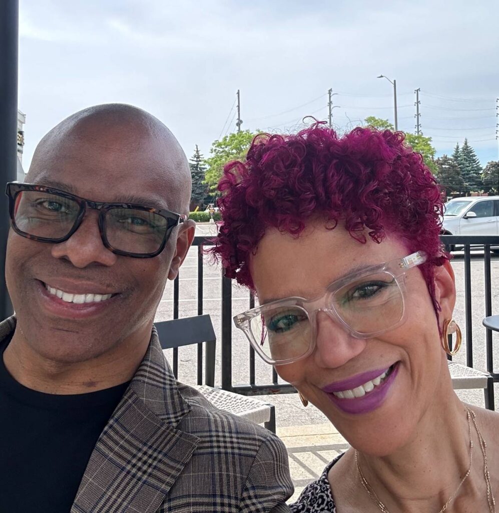 Smiling portrait of Keith and Françoise at a Starbucks.