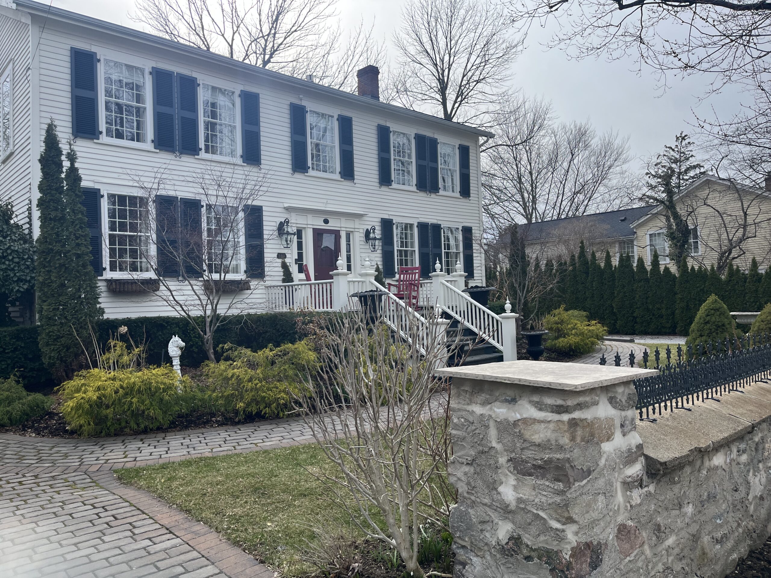 Heritage colonial home on a Niagara-on-the-Lake street, the kind of property GTA buyers consider when moving from GTA to Niagara.