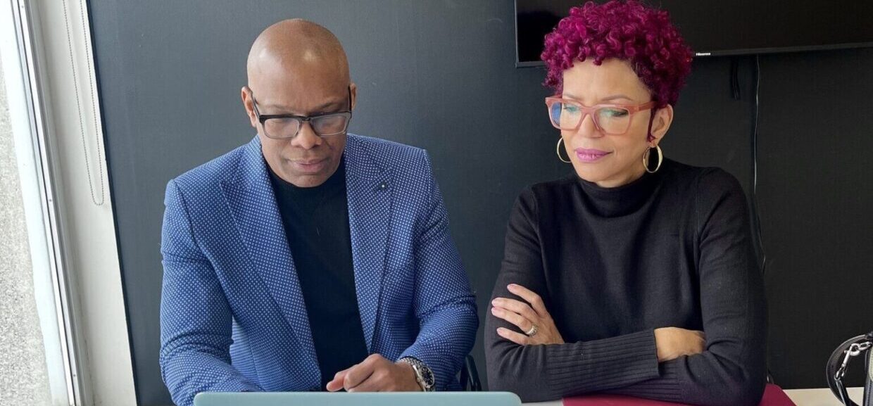 Françoise Pollard, Realtor, and Keith Goldson, Broker, reviewing buyer market analysis in their office