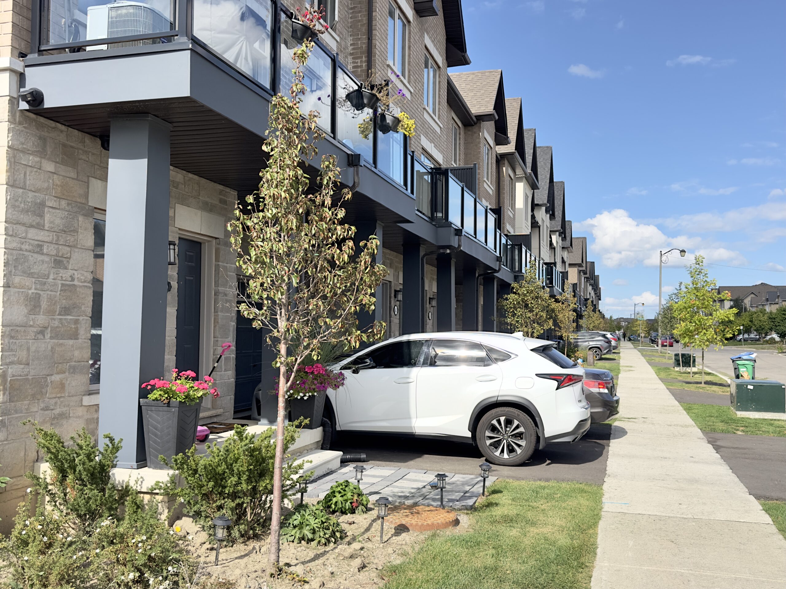 Modern stacked townhouses with balconies in Southfields, Caledon